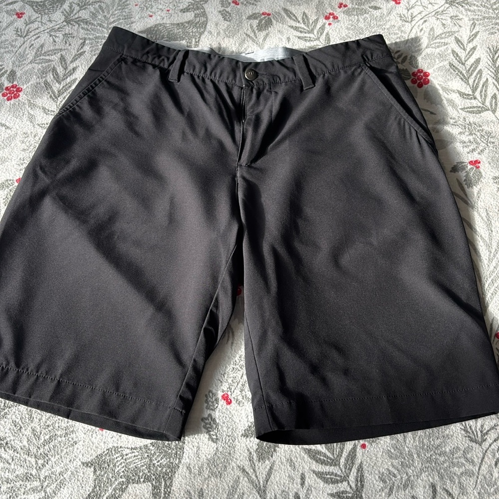 Black Adidas golf shorts.